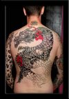 man with japanese dragon tats